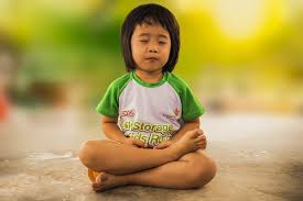 small child meditating